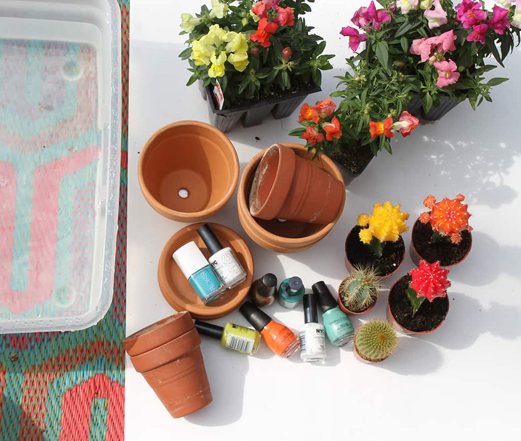 Make colorful DIY marbled flower pots with nail polish