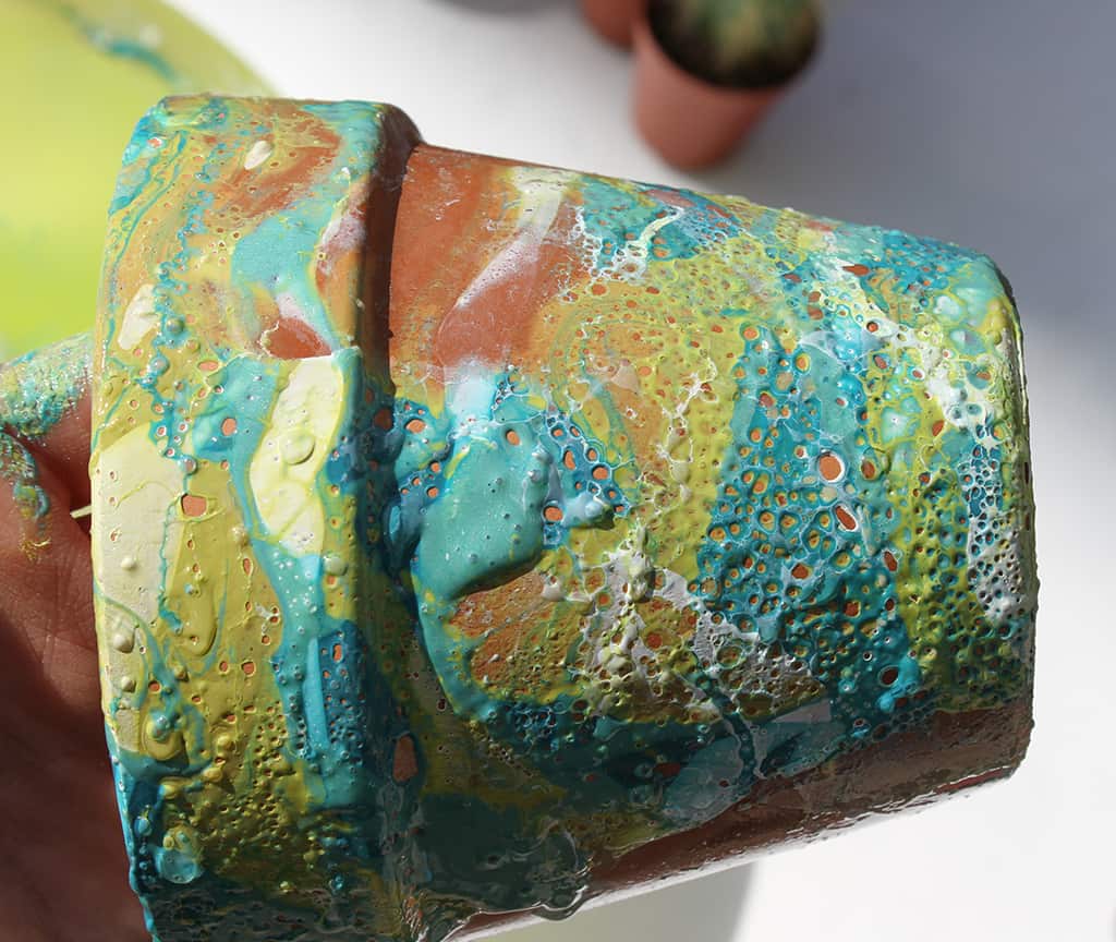 Make colorful DIY marbled flower pots with nail polish