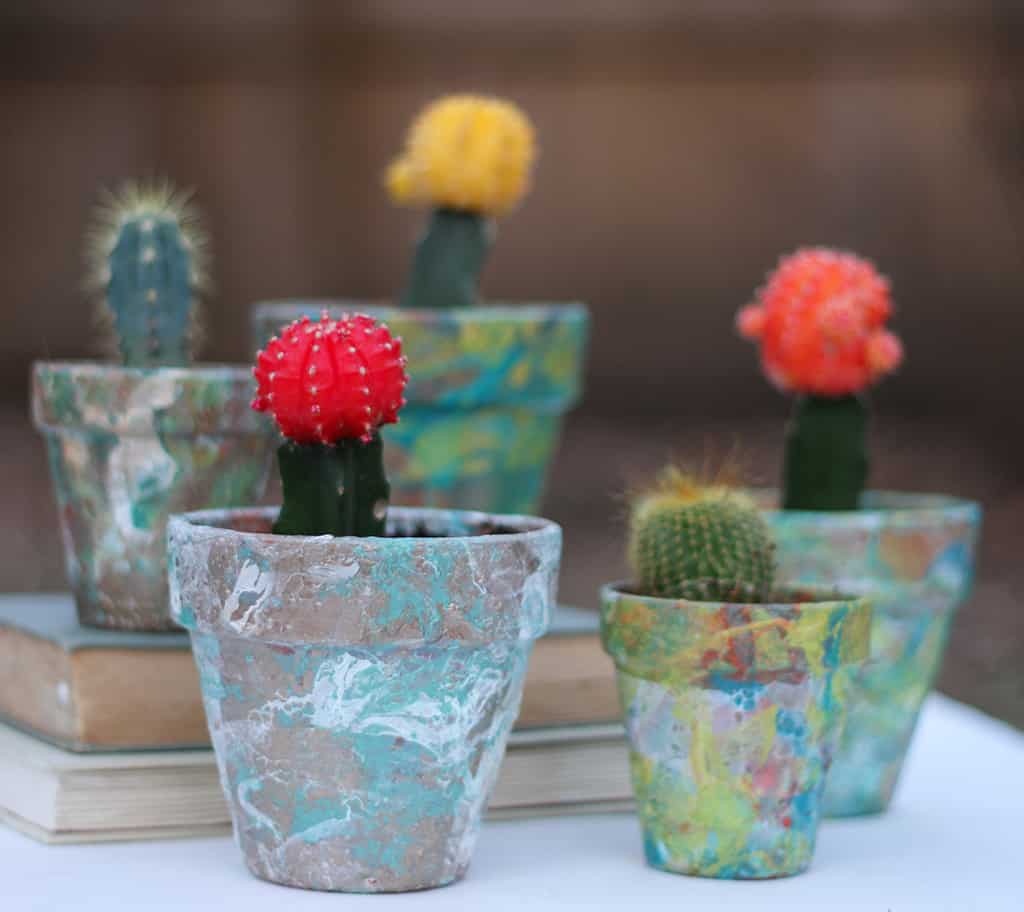Make colorful DIY marbled flower pots with nail polish