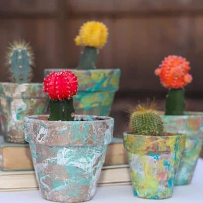 A DIY tutorial on marbling flower pots with nail polish. A cute and inexpensive project.