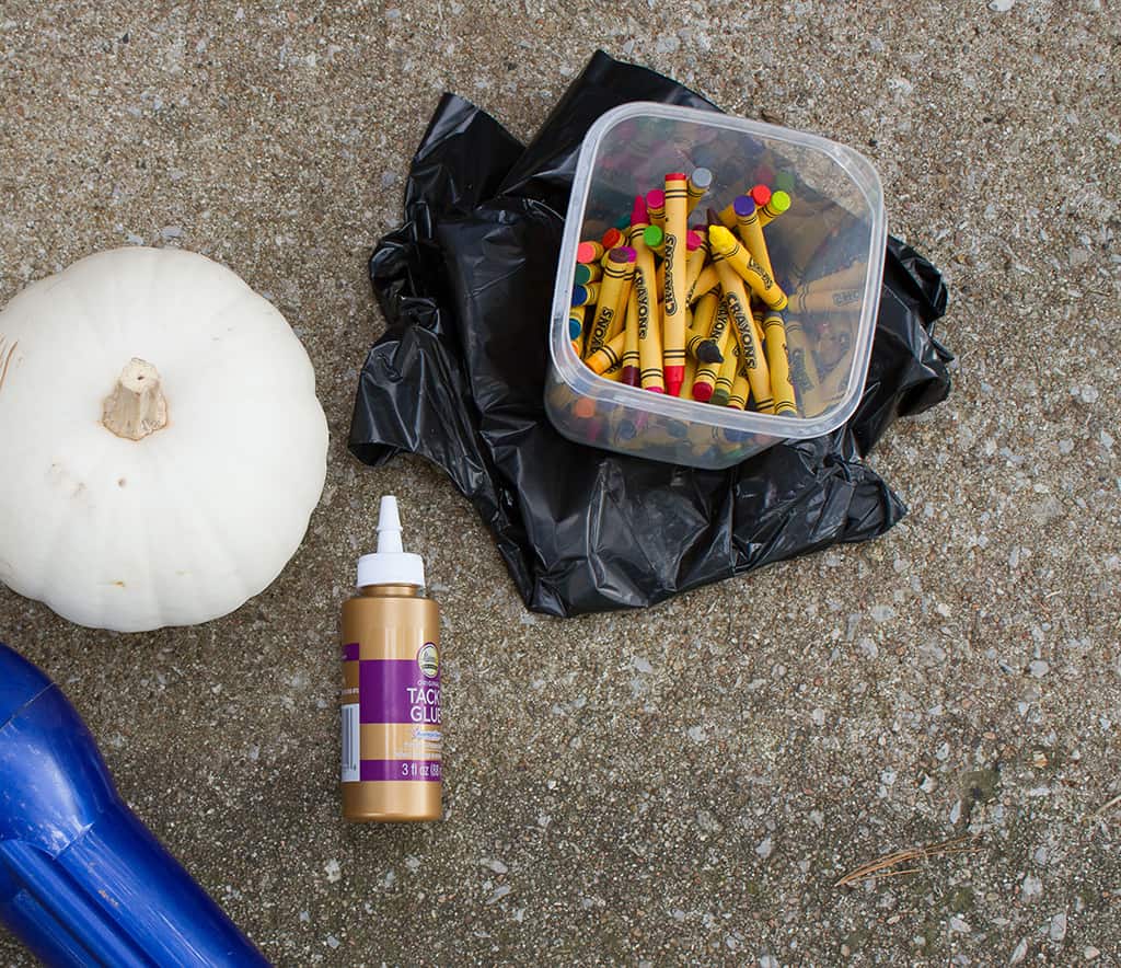 Audrey of Oh So Lovely Blog shares a fun and colorful DIY crayon drip pumpkin tutorial.