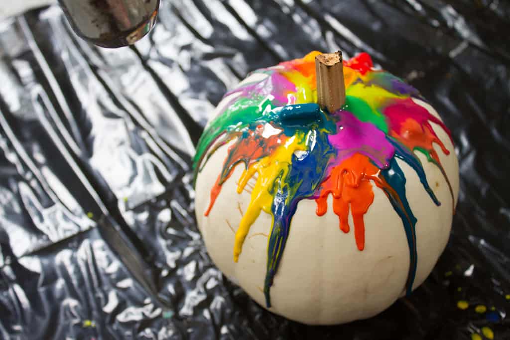 Audrey of Oh So Lovely Blog shares a fun and colorful DIY crayon drip pumpkin tutorial.