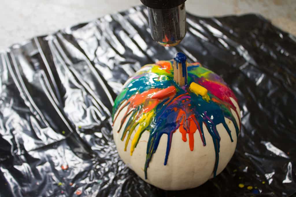 Audrey of Oh So Lovely Blog shares a fun and colorful DIY crayon drip pumpkin tutorial.