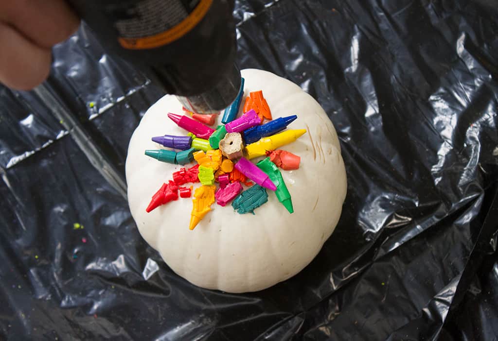 Audrey of Oh So Lovely Blog shares a fun and colorful DIY crayon drip pumpkin tutorial.