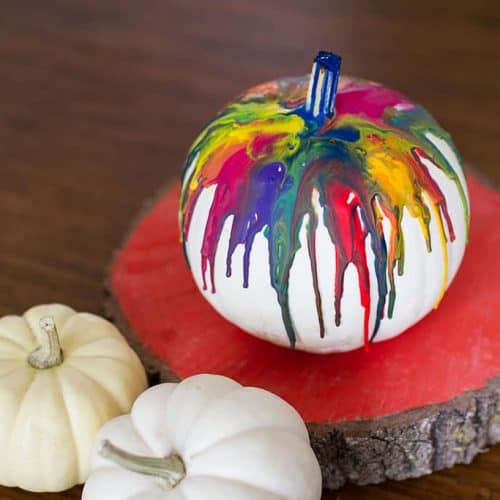 Audrey of Oh So Lovely Blog shares a fun and colorful DIY crayon drip pumpkin tutorial.