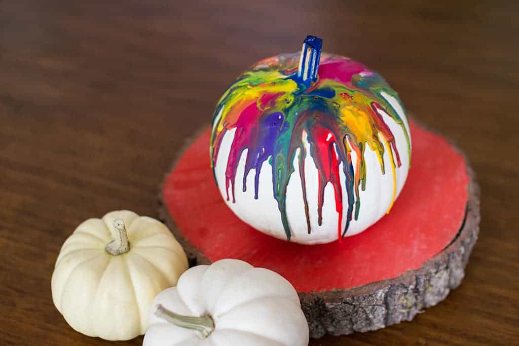 Audrey of Oh So Lovely Blog shares a fun and colorful DIY crayon drip pumpkin tutorial.