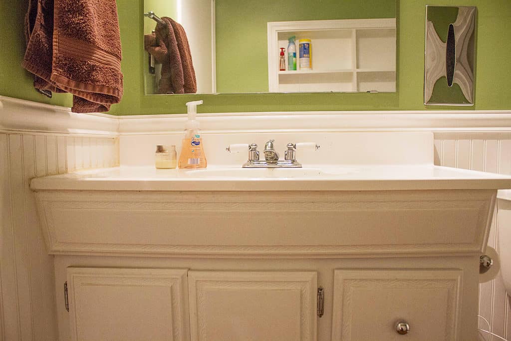 Join Audrey of Oh So Lovely Blog on a quick and super affordable in process tour of her half bathroom update featuring Cabinets Quick!