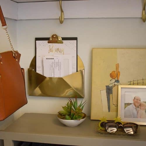 Audrey of Oh So Lovely Blog shares an easy and affordable DIY mini mudroom makeover featuring a custom console cabinet from Deer Lake Designs.