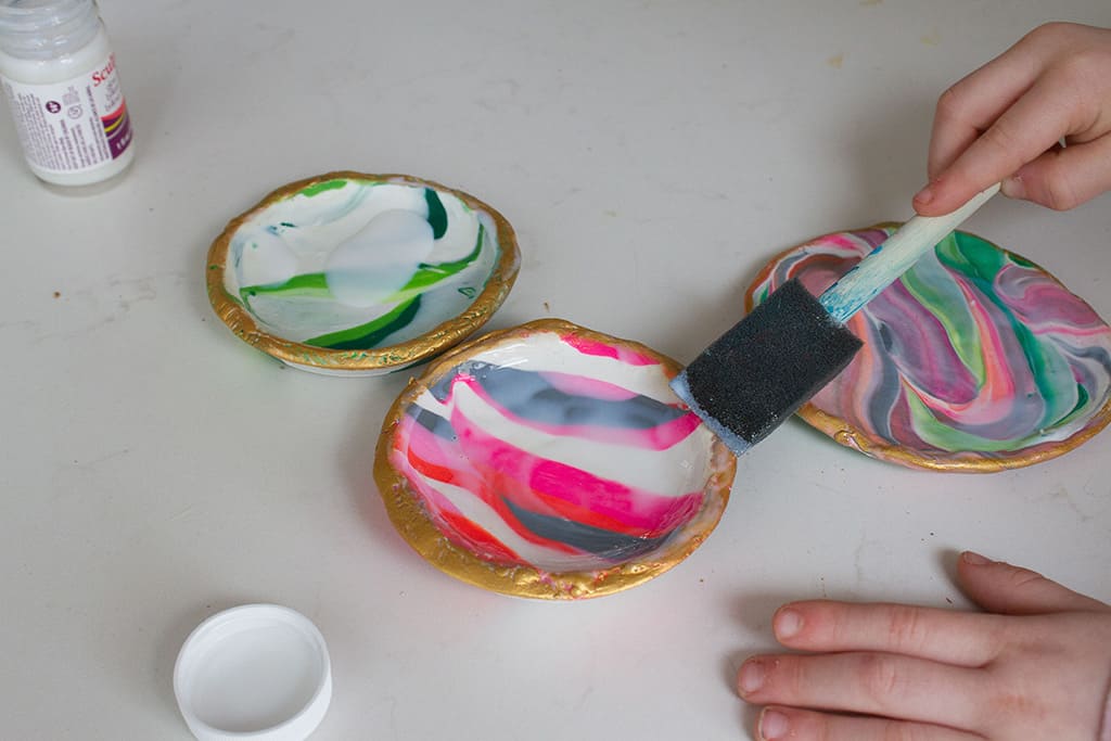 Learn how easy it is to make your own DIY marbled clay dishes with this tutorial from Oh So Lovely Blog!