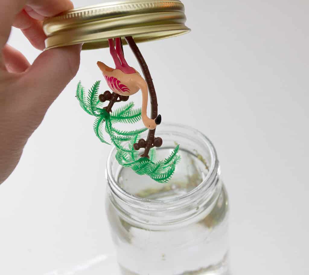 Oh So Lovely Blog shares an easy and fun craft project perfect fo spring and summer...DIY flamingo snow globes!