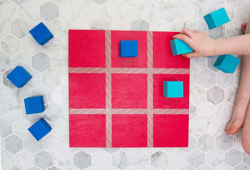 Audrey of Oh So Lovely Blog shares a DIY tic tac toe board tutorial that is super easy and fun to make—perfect for gift giving!