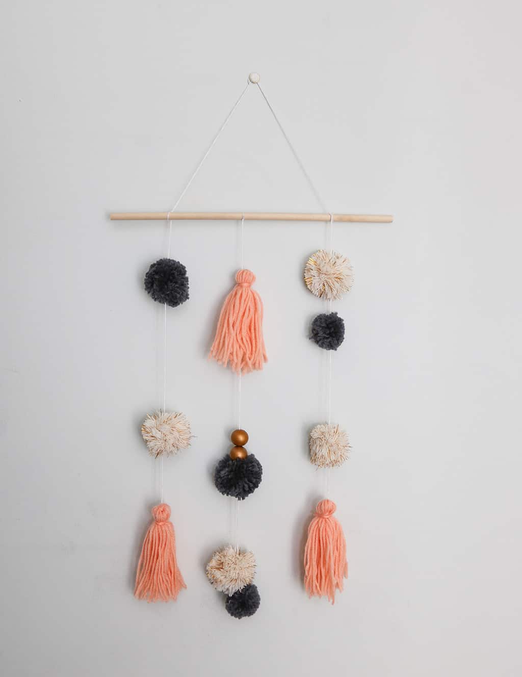 DIY pom pom wall hanging