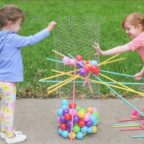 Audrey Kuether of Oh So Lovely shares a life size DIY Kerplunk yard game tutorial—perfect for outdoor entertaining!