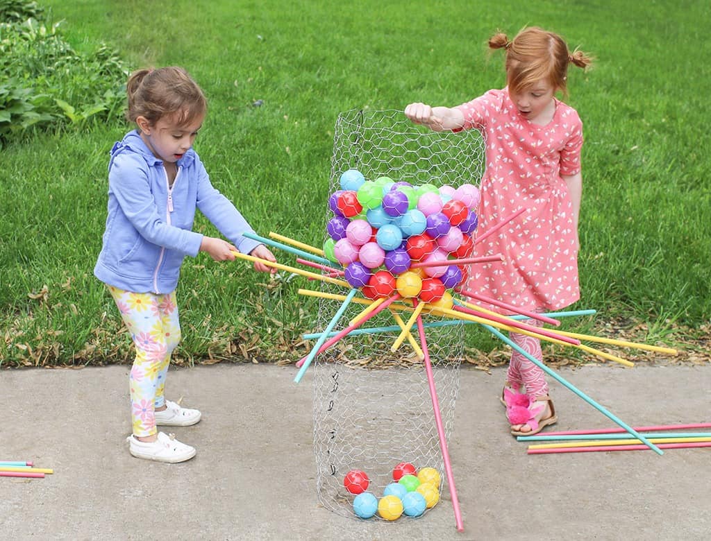 Audrey Kuether of Oh So Lovely shares a life size DIY Kerplunk yard game tutorial—perfect for outdoor entertaining!