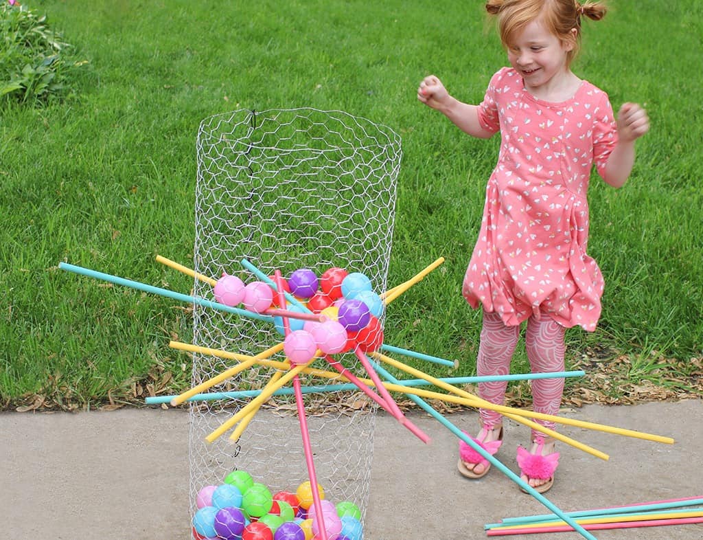 Audrey Kuether of Oh So Lovely shares a life size DIY Kerplunk yard game tutorial—perfect for outdoor entertaining!