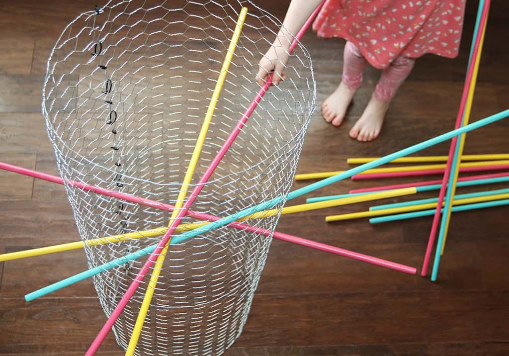 Audrey Kuether of Oh So Lovely shares a life size DIY Kerplunk yard game tutorial—perfect for outdoor entertaining!