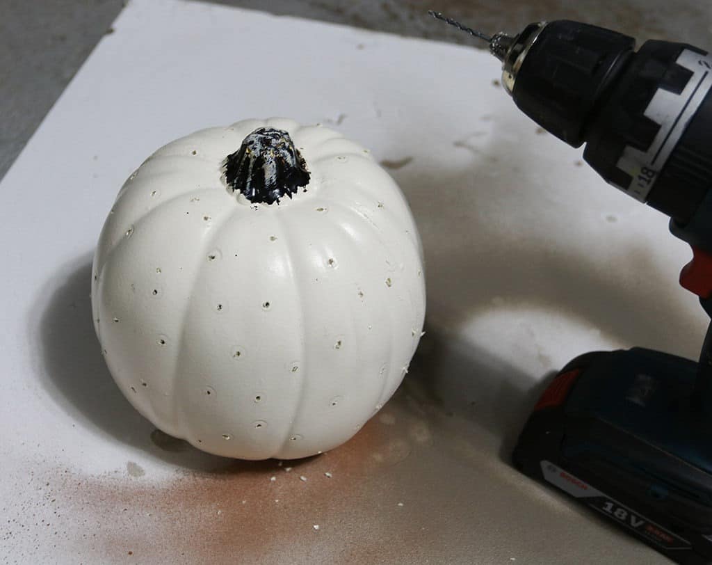 drill holes in pumpkin for a glow of light