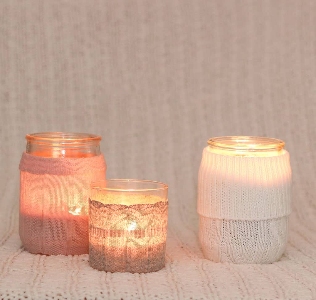 DIY candle sweaters are the cutest! Learn how to easily transform sweater socks into the coziest sweaters for your candles — instant winter mood!