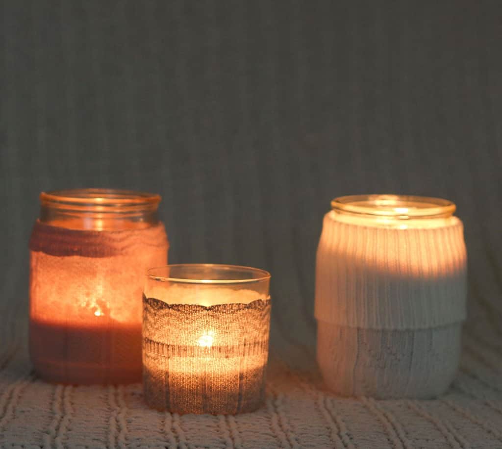 DIY candle sweaters are the cutest! Learn how to easily transform sweater socks into the coziest sweaters for your candles — instant winter mood!