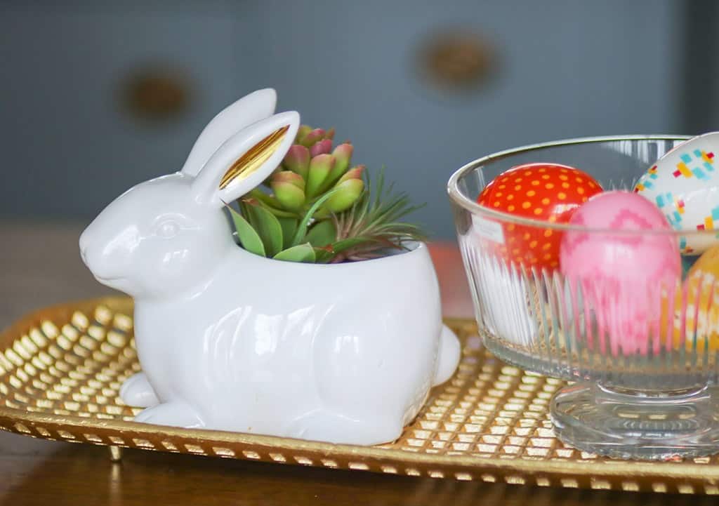 spring home tour colorful easter eggs in a crystal bowl next to a cute glass bunny