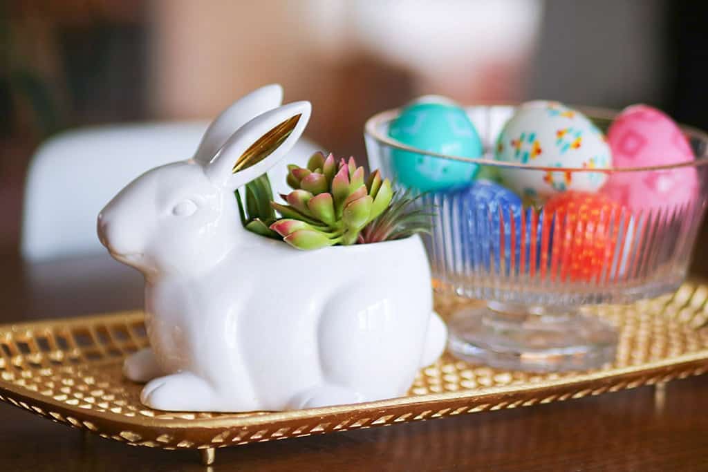 spring home tour colorful easter eggs in a crystal bowl next to a cute glass bunny