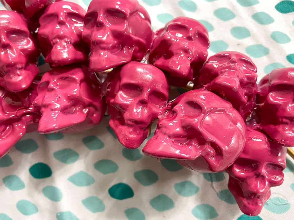 Closeup of spray painted skulls on a DIY wreath