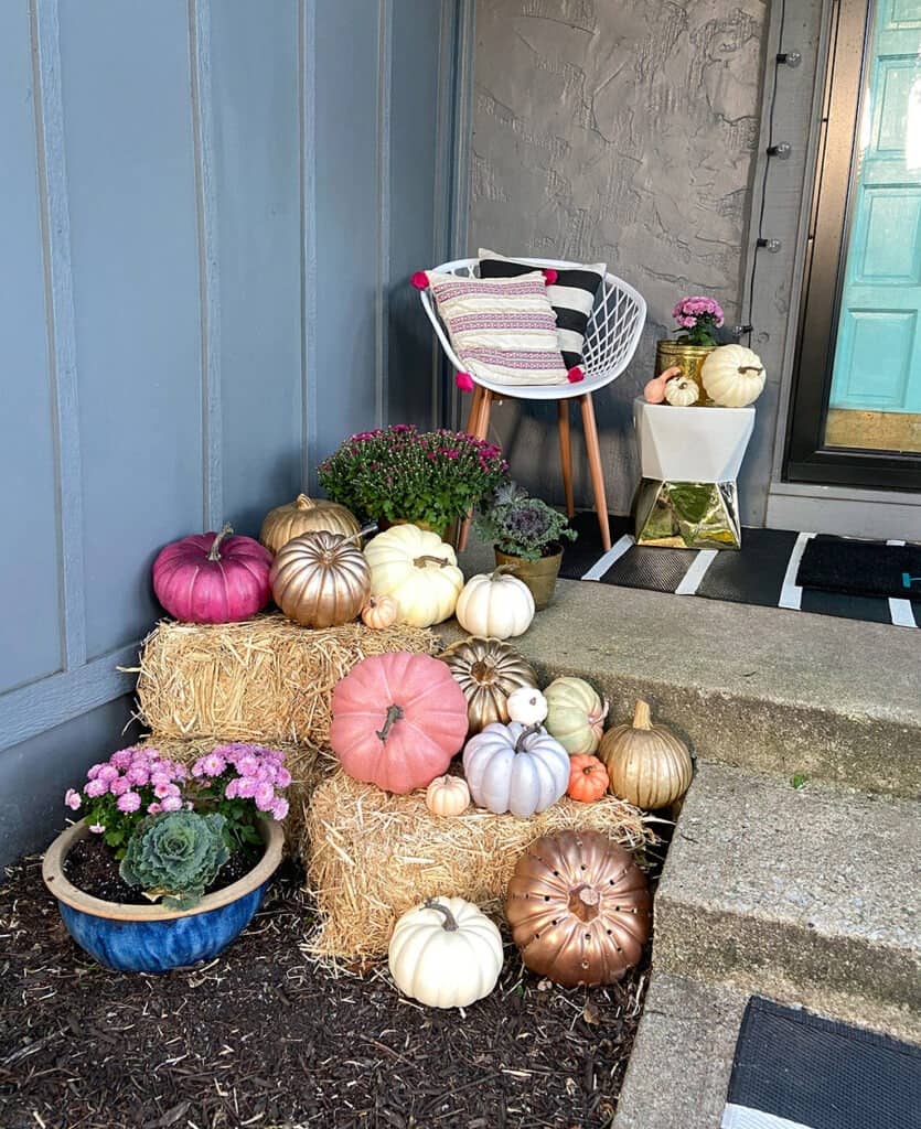 fall front porch with decor pumpkins and plants - outdoor fall decor