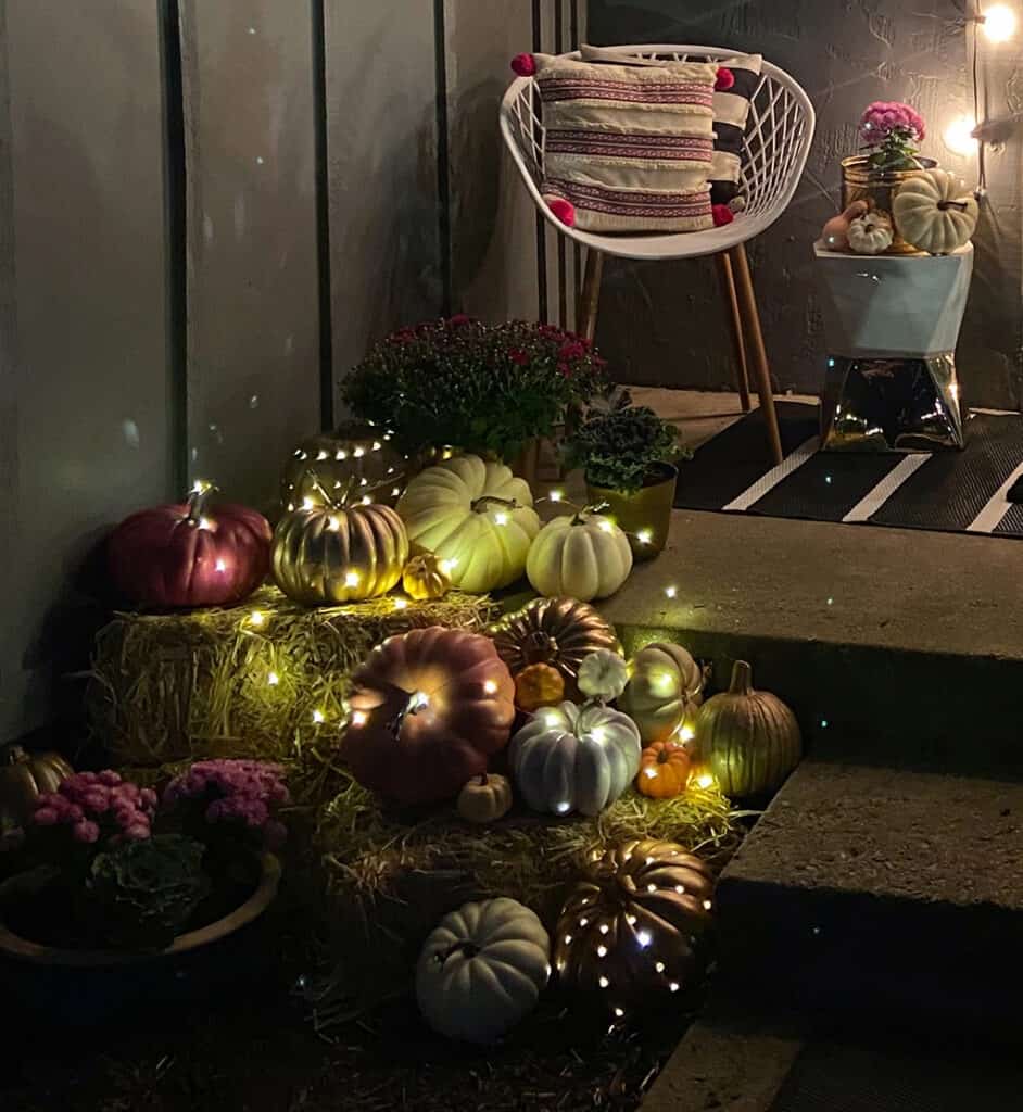 fall front porch with decor pumpkins and plants - outdoor fall decor