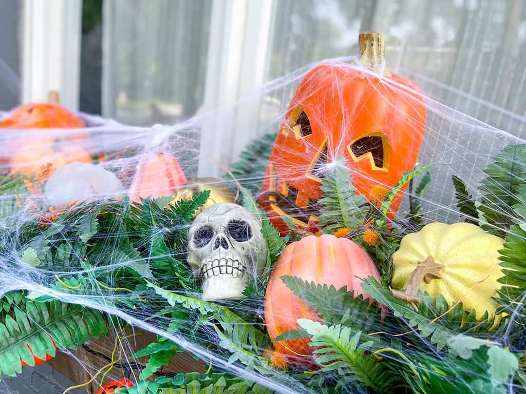 Faux pumpkins and spider webs! A fun & unique outdoor Halloween decor tour – at both day and nighttime! 