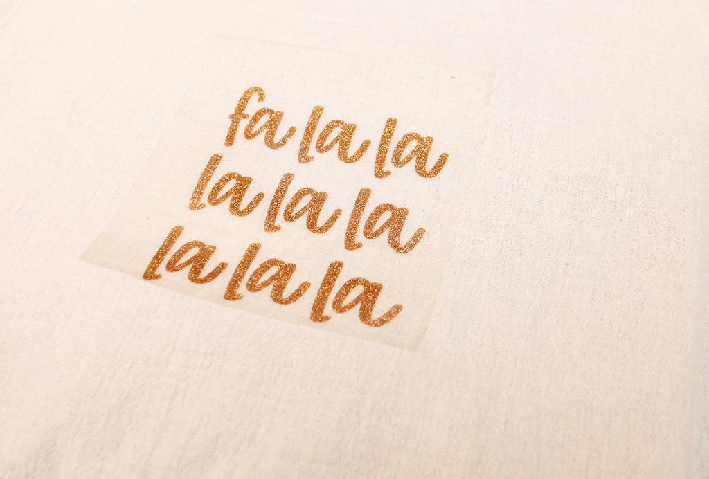 gold glitter fa la la tea towel made with cricut joy