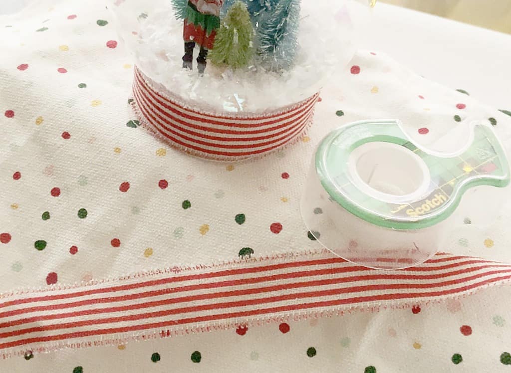 Add ribbon to snow globe base