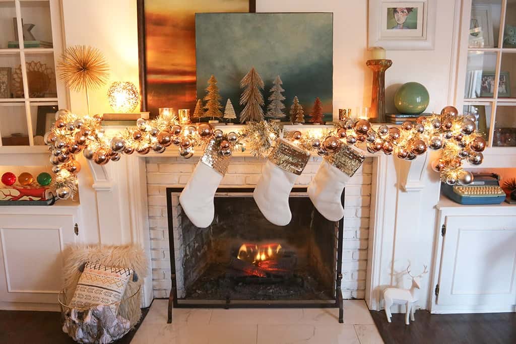 A modern and colorful holiday home tour full of affordable festivity and touches of fun throughout! A festive fireplace