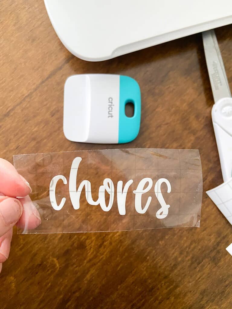 Use Cricut vinyl to personalized your DIY upcycled chore chart