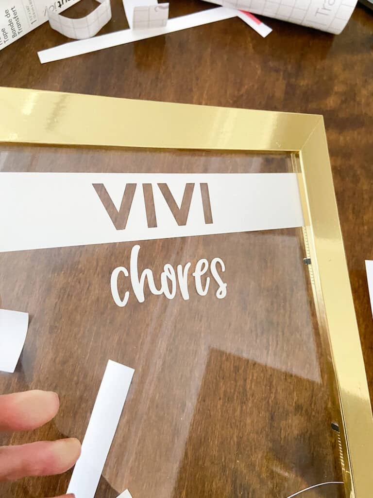 Use Cricut vinyl to personalized your DIY upcycled chore chart