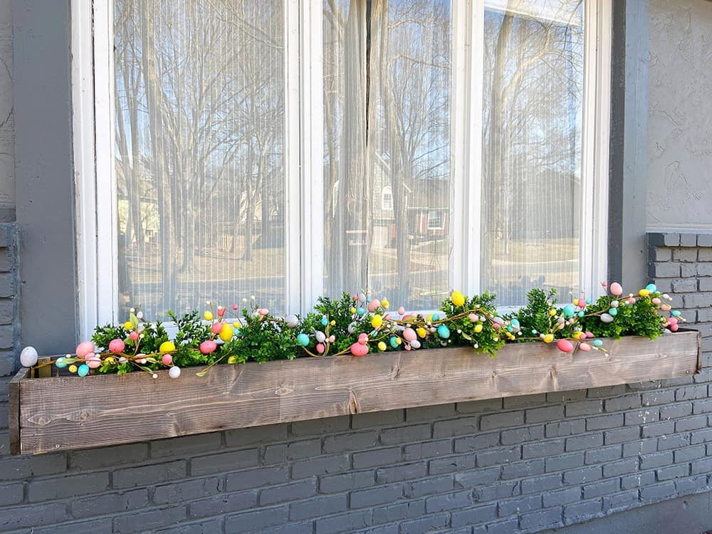 Easter decor ideas for your front porch and window boxes. Get the festive, cute, and colorful look quickly and affordably!