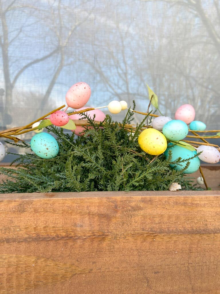 Easter decor ideas for your front porch and window boxes. Get the festive, cute, and colorful look quickly and affordably!