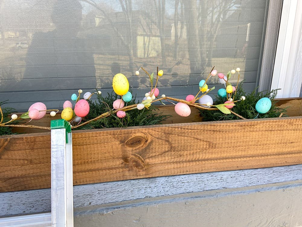 Easter decor ideas for your front porch and window boxes. Get the festive, cute, and colorful look quickly and affordably!