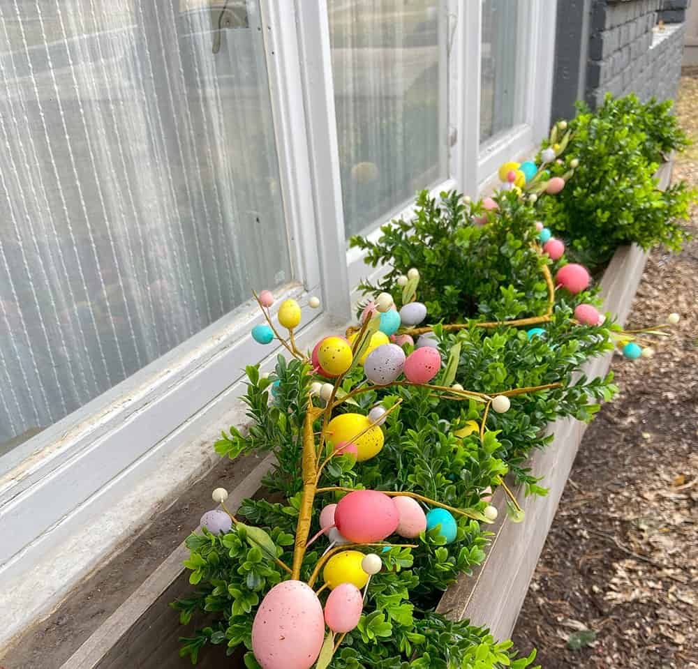 Easter decor ideas for your front porch and window boxes. Get the festive, cute, and colorful look quickly and affordably!