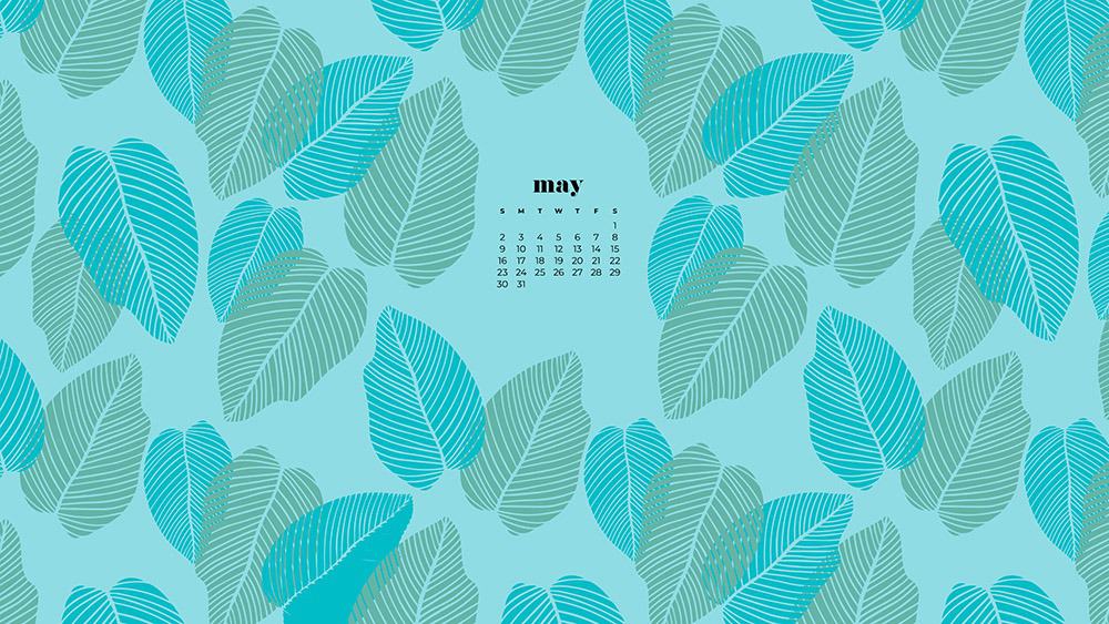 modern green and turquoise palm leaves on a aqua background 