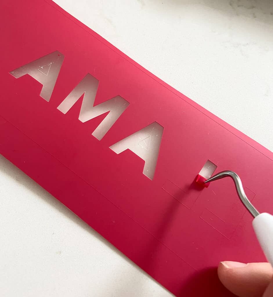 Weeding a LLAMA iron on design in red