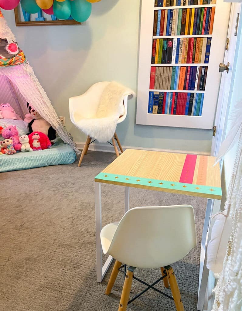 Using my Cricut Joy and some colorful vinyl, a fun and colorful table top design gave new life to our play room desk in just 10 minutes!