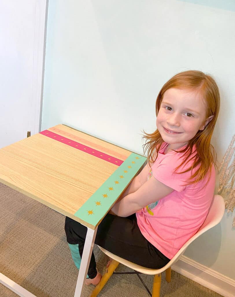 Using my Cricut Joy and some colorful vinyl, a fun and colorful table top design gave new life to our play room desk in just 10 minutes!