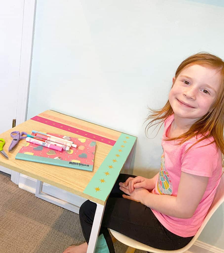 Using my Cricut Joy and some colorful vinyl, a fun and colorful table top design gave new life to our play room desk in just 10 minutes!