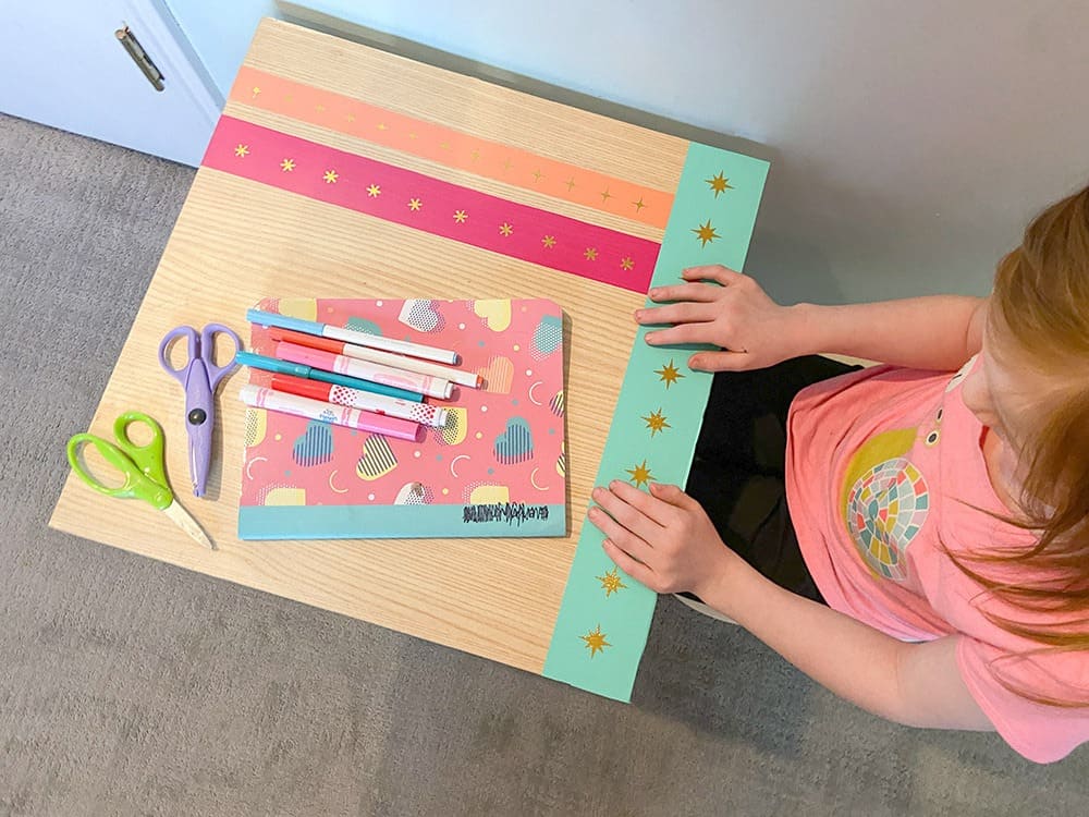 Using my Cricut Joy and some colorful vinyl, a fun and colorful table top design gave new life to our play room desk in just 10 minutes!