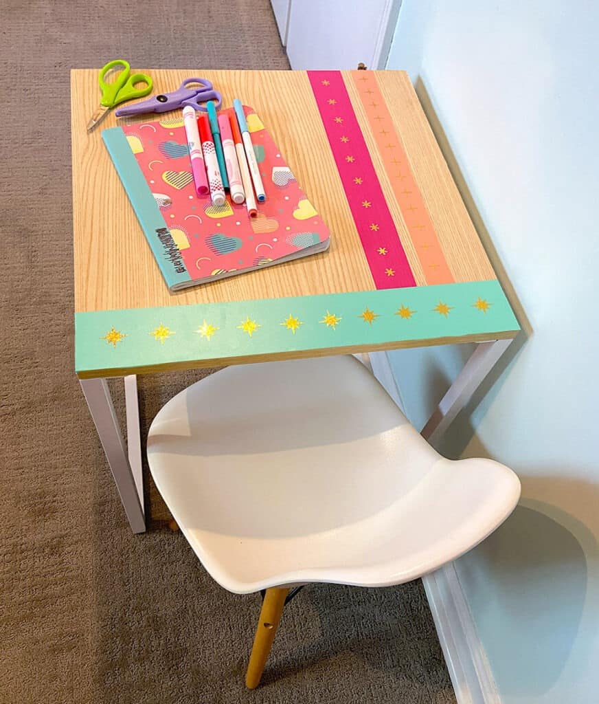 Using my Cricut Joy and some colorful vinyl, a fun and colorful table top design gave new life to our play room desk in just 10 minutes!