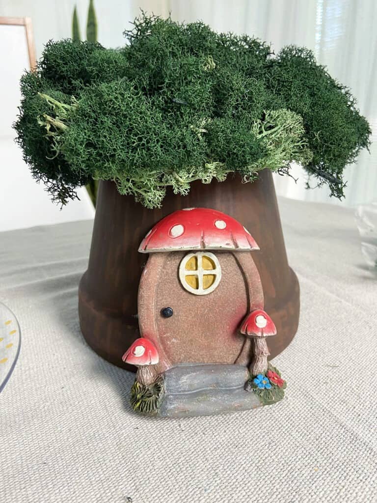 hot glue gnome doorway to a terra cotta pot tree