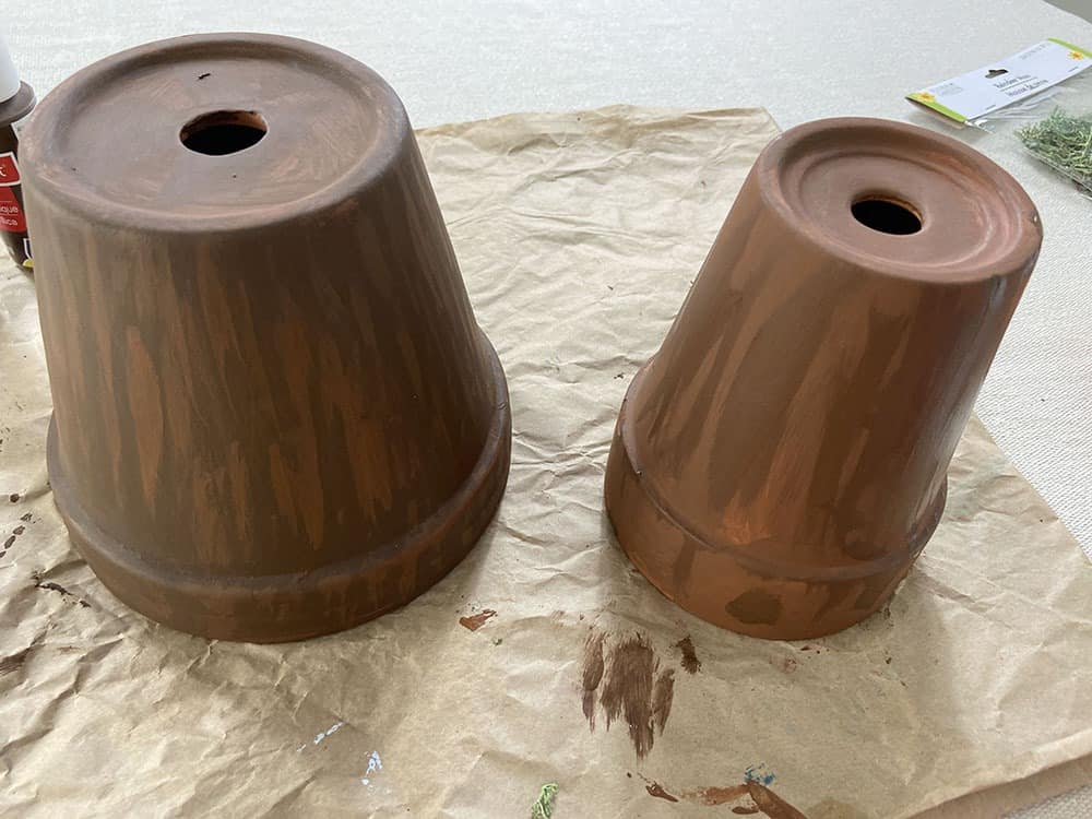 painting terra cotta pots brown to mimic tree look for gnome garden