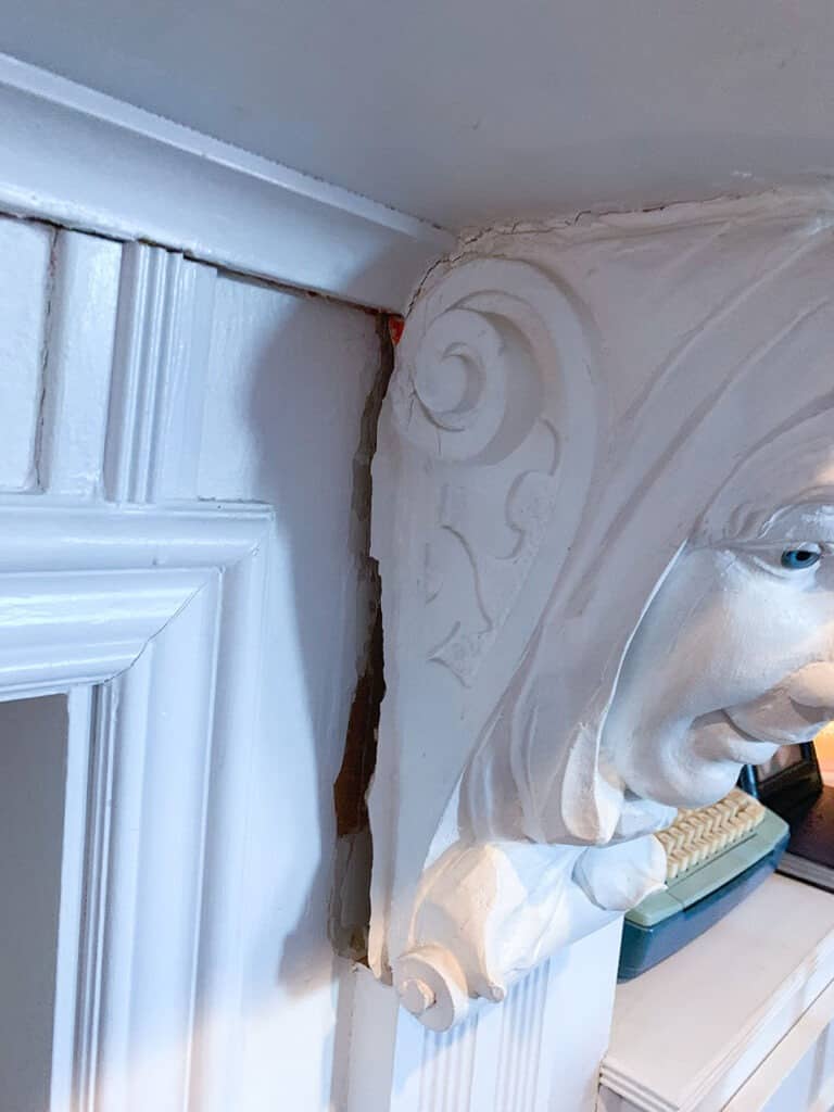 removing creepy corbels from a fireplace A step-by-step DIY fireplace makeover tutorial – See how it went from extra creepy to clean and classic on a very small budget! 