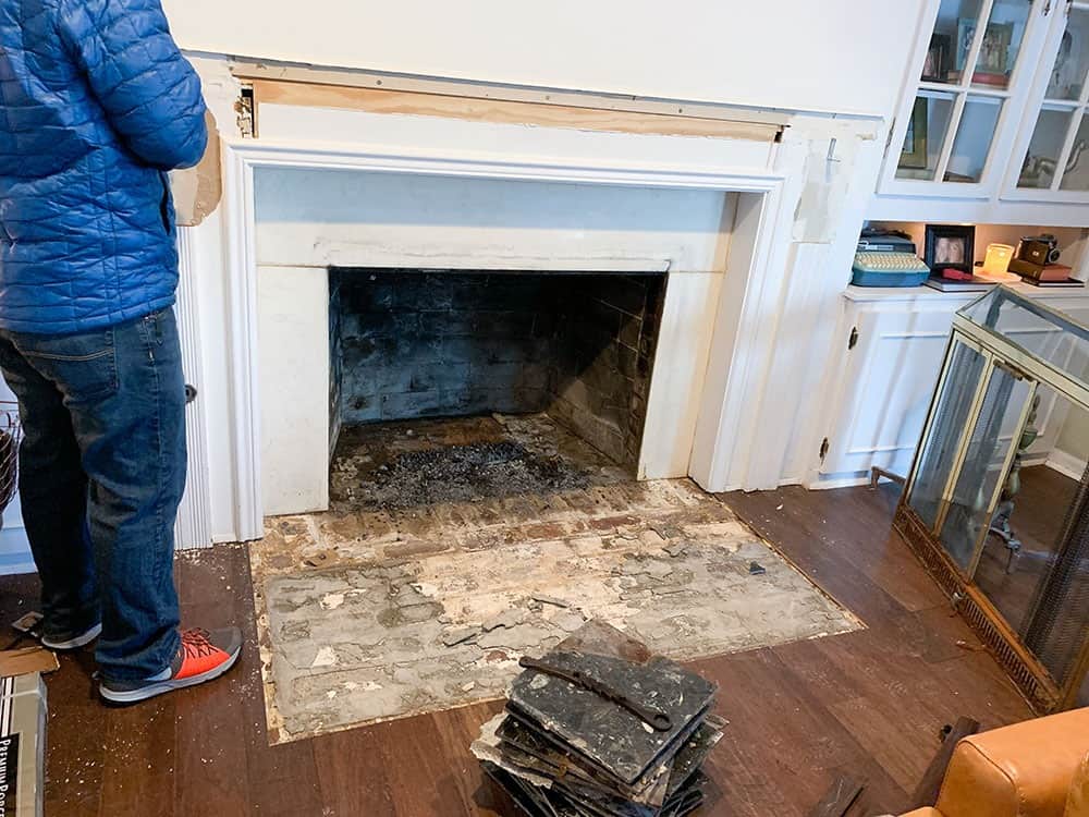 demo of old fireplace surround and corbels - fireplace makeover