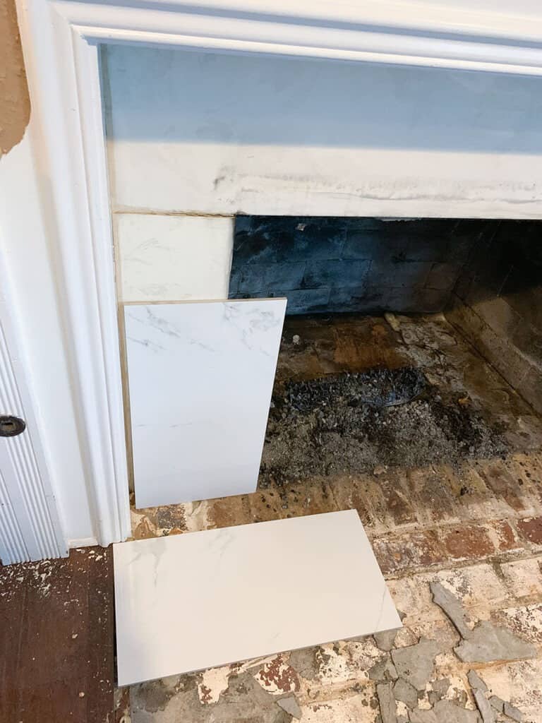 removing old fireplace tile - fireplace makeover